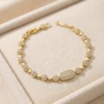 Brățară damă placată cu aur 14K, 17-19 cm, model Lux cu bile strălucitoare și element central decorativ cristale, Noem®