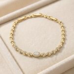 Brățară damă placată cu aur 14K, 16-20 cm, 7 mm, model elegant cu detalii tip frunză și pietre fine, Noem®