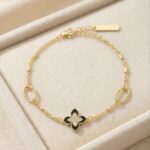 Bratara eleganta placata cu aur 14K, cu trifoi motiv floral negru si detalii cu cristale fine, Noem®