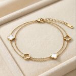 Bratara din otel inoxidabil, placata cu aur 14k, model dublu cu pandantive trifoi sidef, Noem®