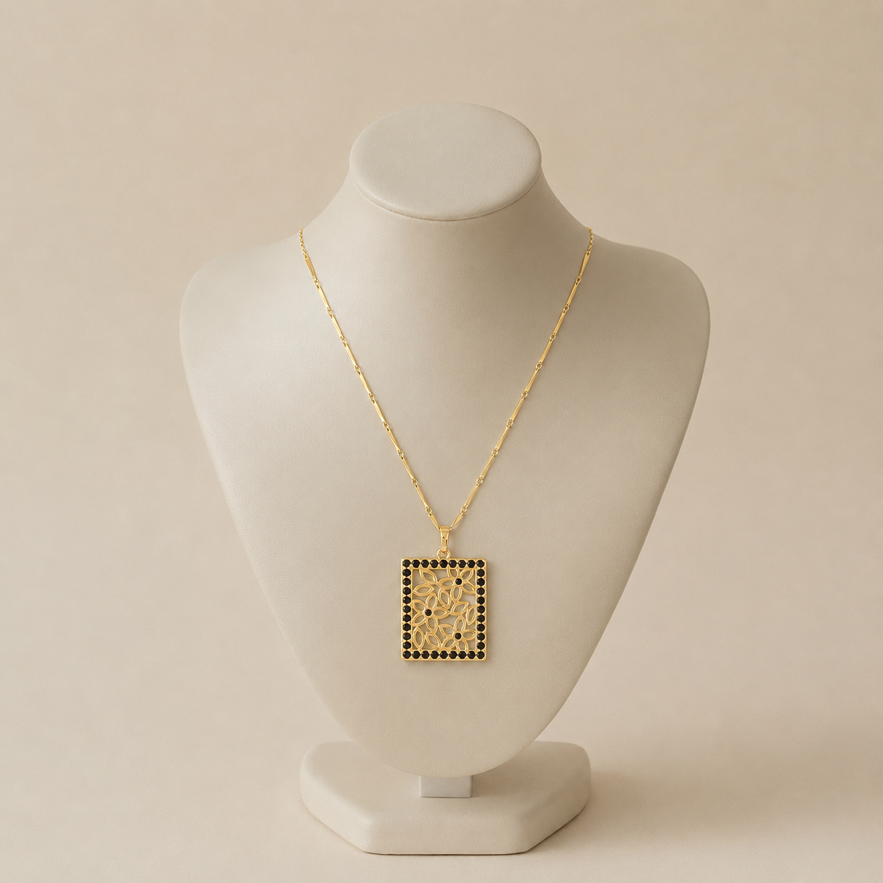 ChatGPT Image Aug 7, 2026, 05_43_16 PM Colier elegant din oțel inoxidabil placat cu aur de 14K, pandantiv casetă dreptunghiulară cu flori traforate și contur pavat cu pietre cristal negru, lungime 45 cm, Noem® - imagine 1
