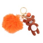 Breloc simpatic cu ursuleț maro, pompon pufos portocaliu și clopoțel, lungime 13 cm, Noem® - imagine 2
