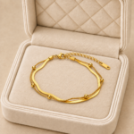Brățară de picior dublă din oțel inoxidabil placat cu aur de 14 K, model cu lănțișoare suprapuse și mărgele aurii, grosime 3 mm, 23+4.5 cm, Noem®